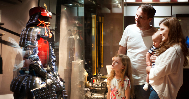 family admiring an exhibit inside Durham University's Oriental Museum